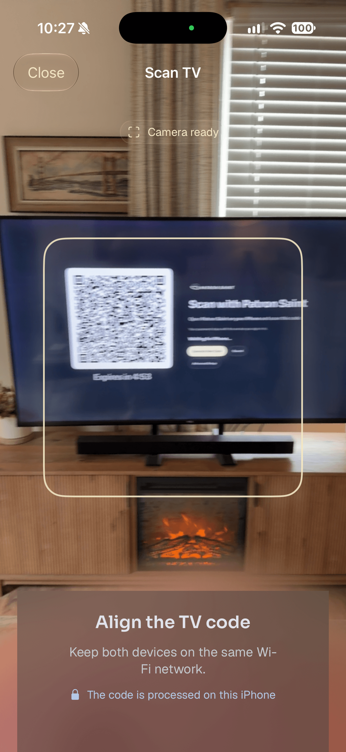 Patron Saint Connect scanning a pairing code displayed on Apple TV.